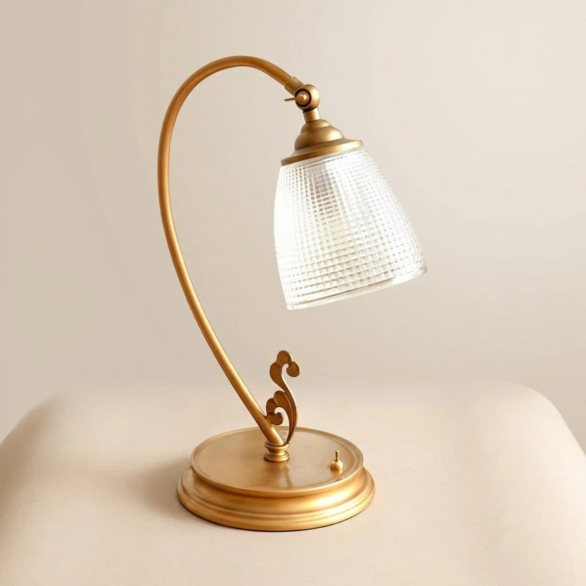 Table Lamp With Curved Gold Metal Arm And Textured Glass Shade - Image 1